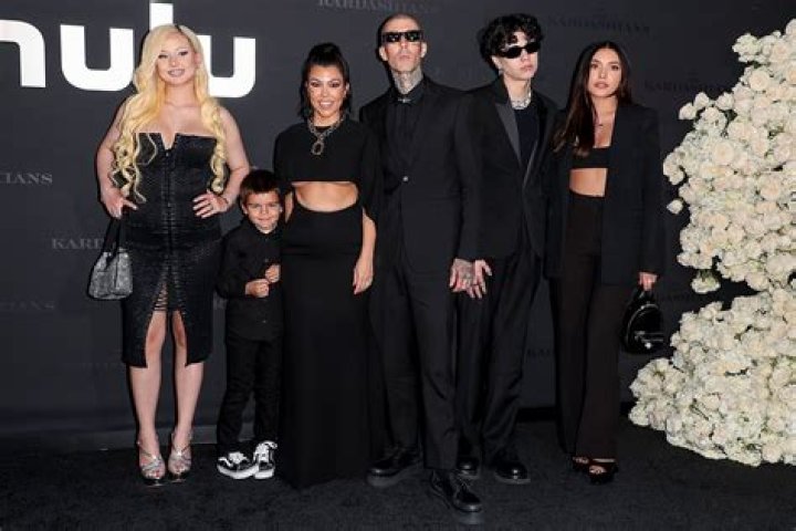 Kourtney Matches With Travis Barker & Kids In Black At ‘Kardashians’ Premiere