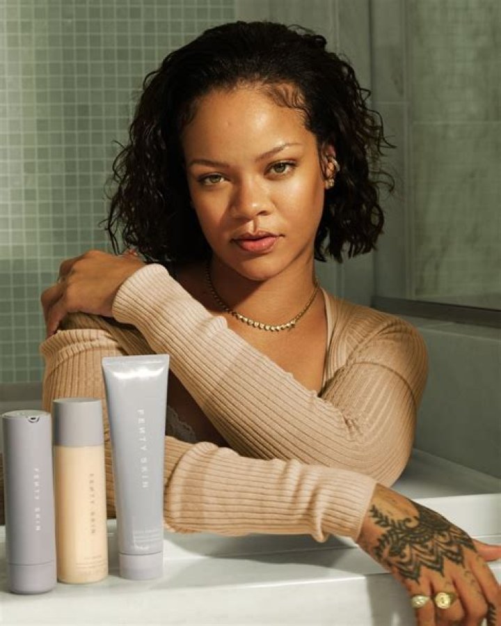 Rihanna Rocks Braids & Chows Down On Caviar In Bed After Selling Out New Fenty Perfume – Photos